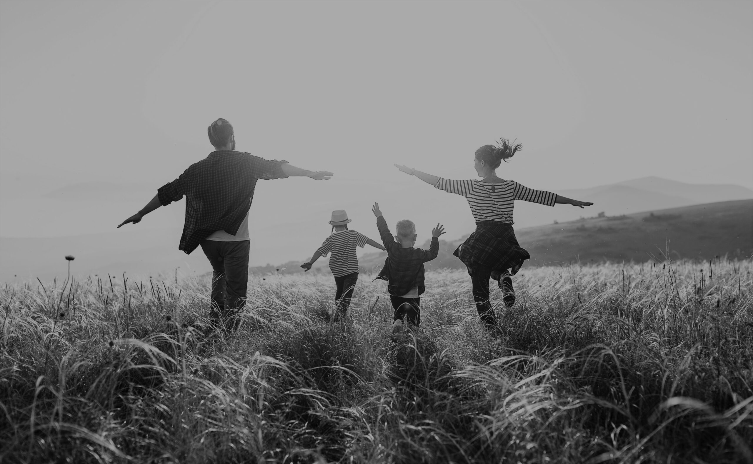 Happy family: mother, father, children son and daughter on sunset